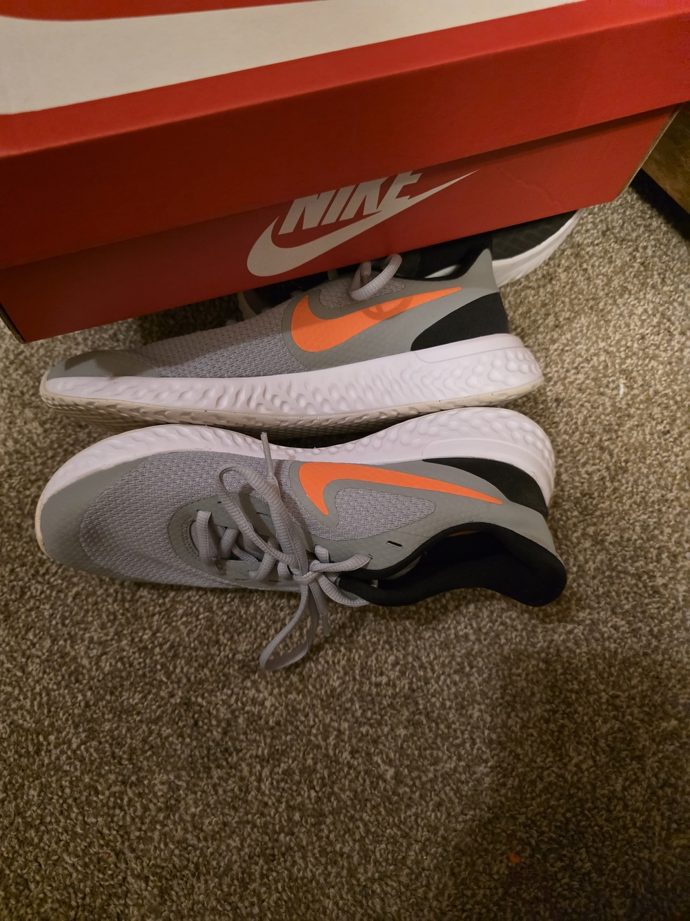 Nike Grey Running Shoes with Orange Swoosh